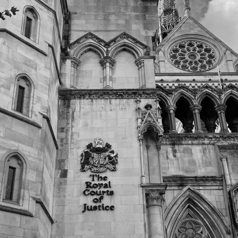 The coat of arms and sign of the Royal Courts of Justice, London