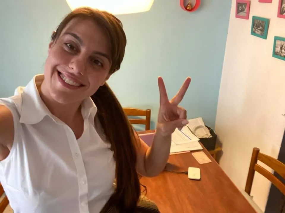 Claudia at home, just after passing her final exam in legal translation